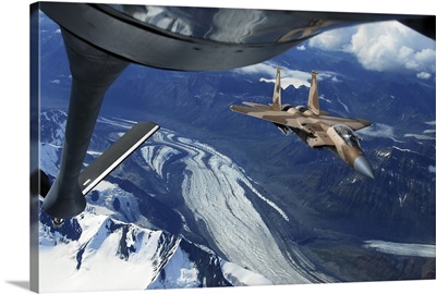 A US Air Force F15C Eagle positioning itself behind a KC135R Stratotanker over Alaska