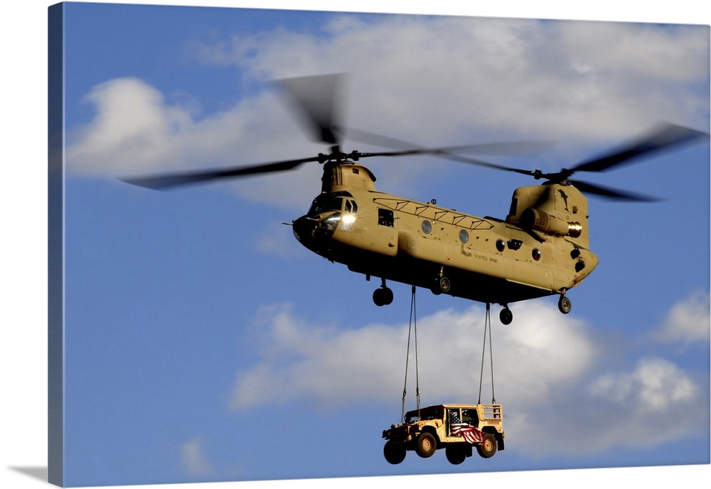 March 4, 2010 - A U.S. Army CH-47 Chinook helicopter transporting a Humvee prepares to land at a forward operating base in...