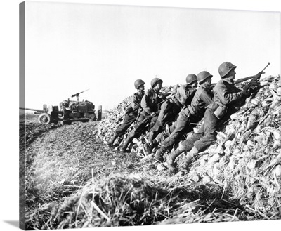 A US Infantry anti-tank crew fires on Nazis somewhere in Holland