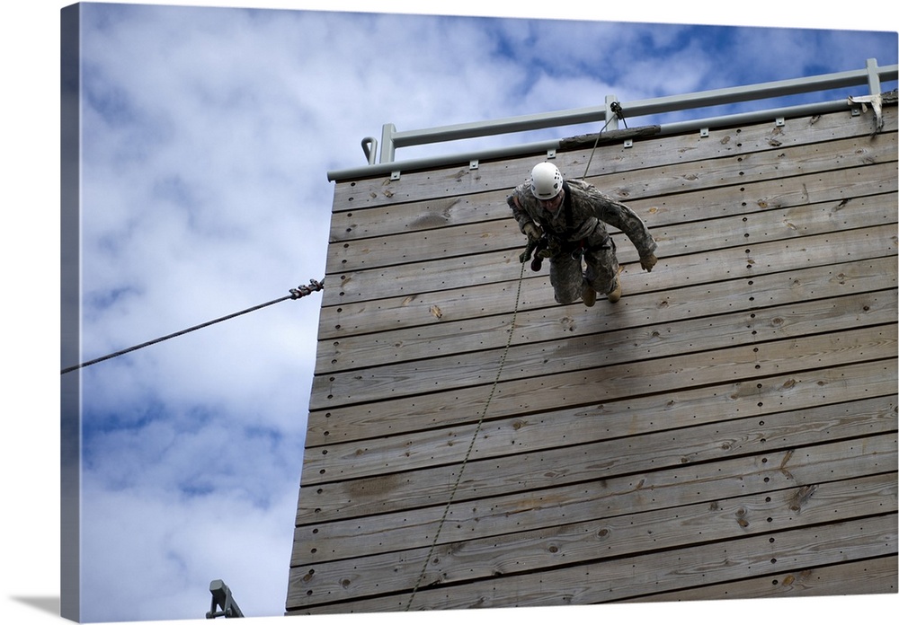 January 17, 2013 - A U.S. Soldier runs down a 40-foot rappelling wall at the training tower at Eglin Air Force Base, Flori...