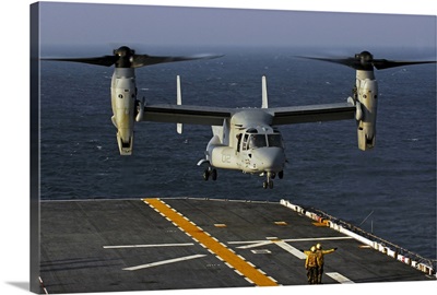 A V22 Osprey aircraft landing on the flight deck the USS Bataan