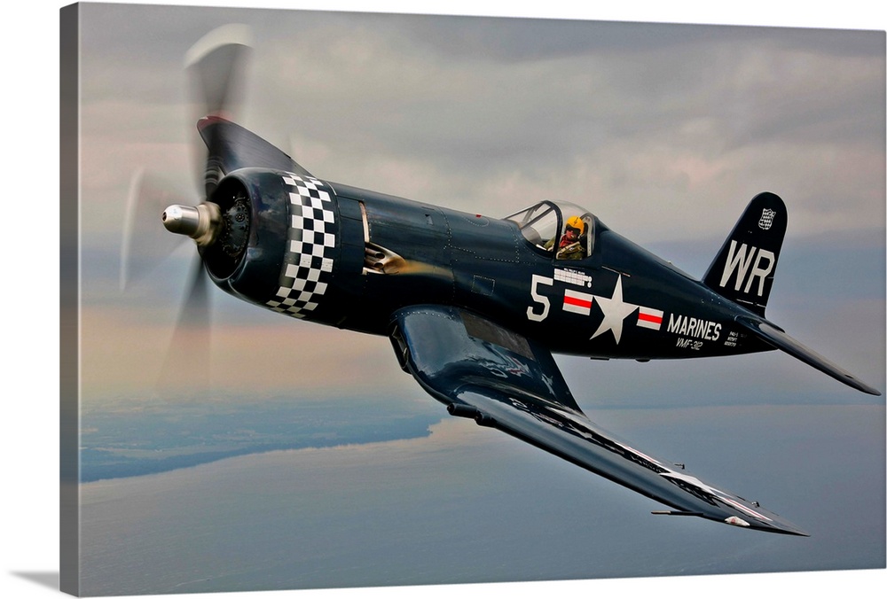 A Vought F4U-5 Corsair in VMF-312 markings during the Korean War, flying over Oshkosh, Wisconsin.