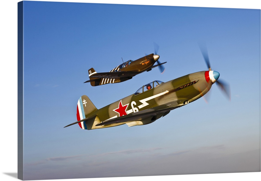 A Yakovlev Yak-9 fighter plane and a North American P-51A Mustang in flight near Chino, California.