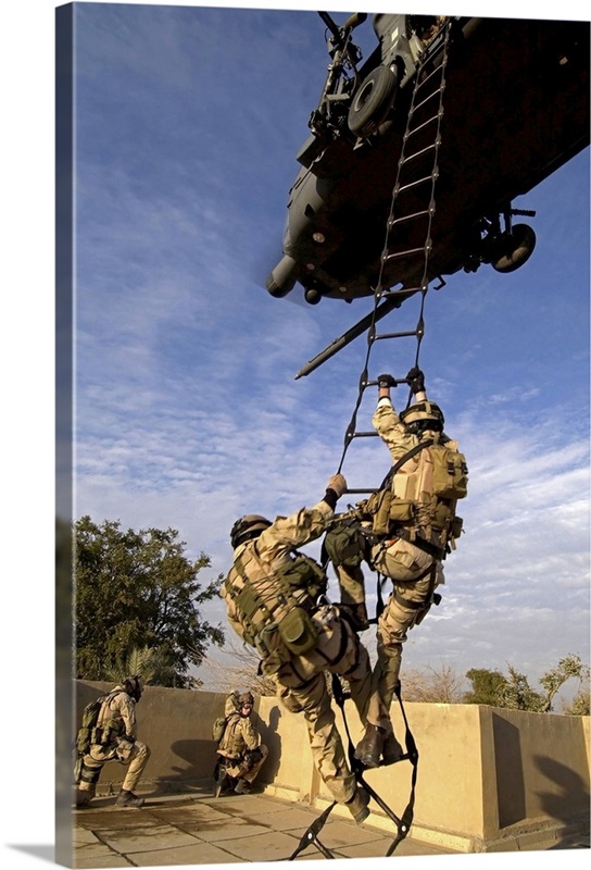 Air Force pararescuemen are extracted by an HH60G Pave Hawk helicopter ...