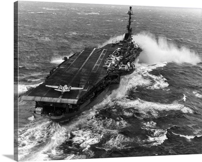 Aircraft Carrier USS Essex (CVA-9) Taking Spray Over The Bow In Heavy Seas