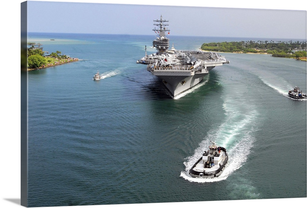 Aircraft carrier USS Ronald Reagan transits Pearl Harbor into Hawaii.