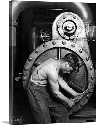 American History photo of a power house mechanic working on a steam pump