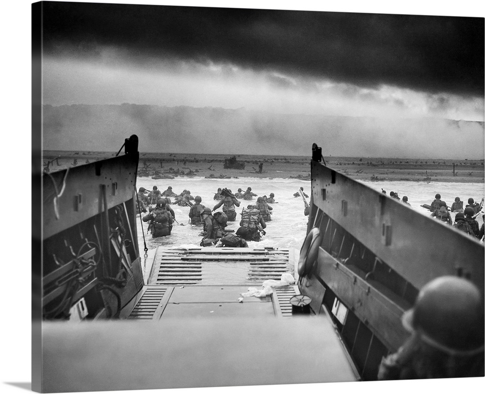 Digitally restored vintage World War II photo of American troops wading ashore on Omaha Beach during the D-Day invasion on...