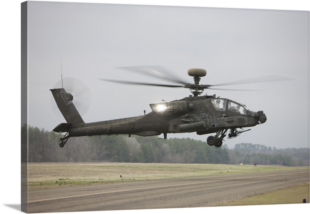 An AH-64 Apache helicopter in midair, Conroe, Texas.