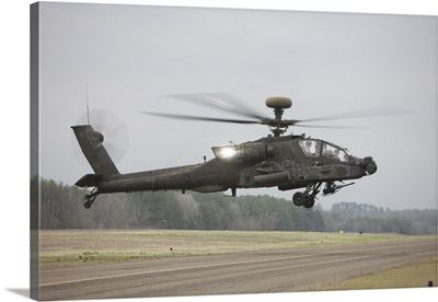 An AH-64 Apache helicopter in midair, Conroe, Texas