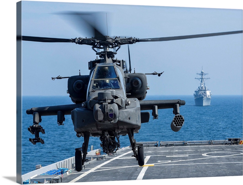 An Army AH-64D Apache helicopter takes off from USS Ponce.