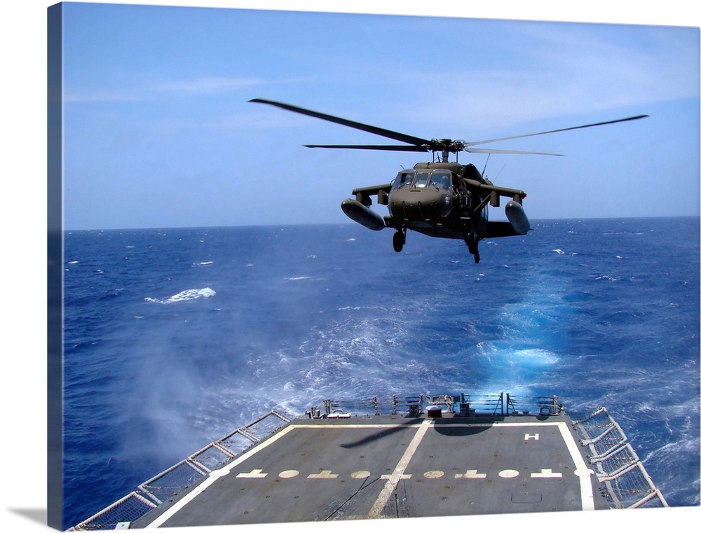 An Army UH-60 Black Hawk helicopter landing aboard the USS Underwood off the coast of Honduras.