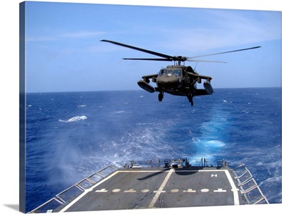 An Army UH-60 Black Hawk helicopter landing aboard the USS Underwood