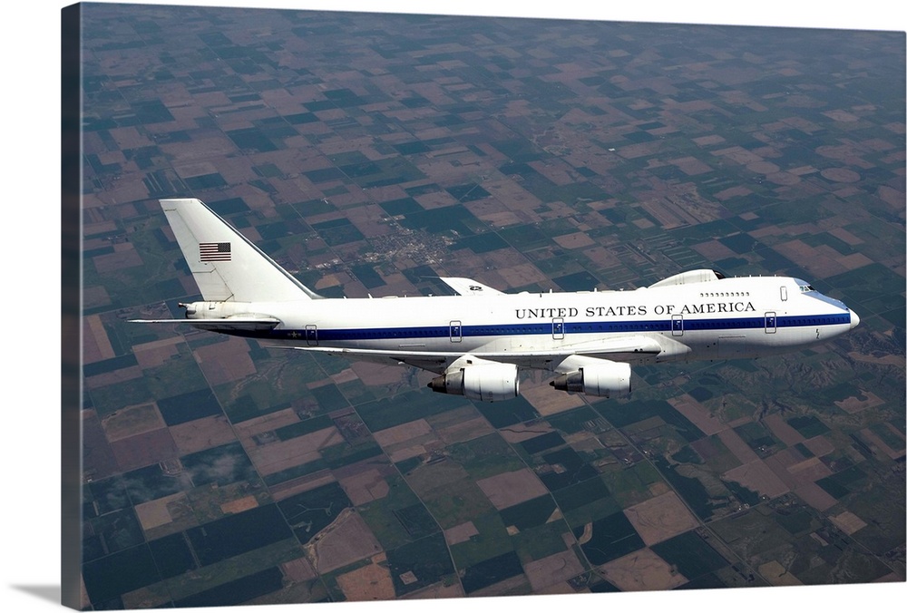 An E-4B National Airborne Operations Center (NAOC) aircraft flies high over the Midwest on a training mission out of Offut...