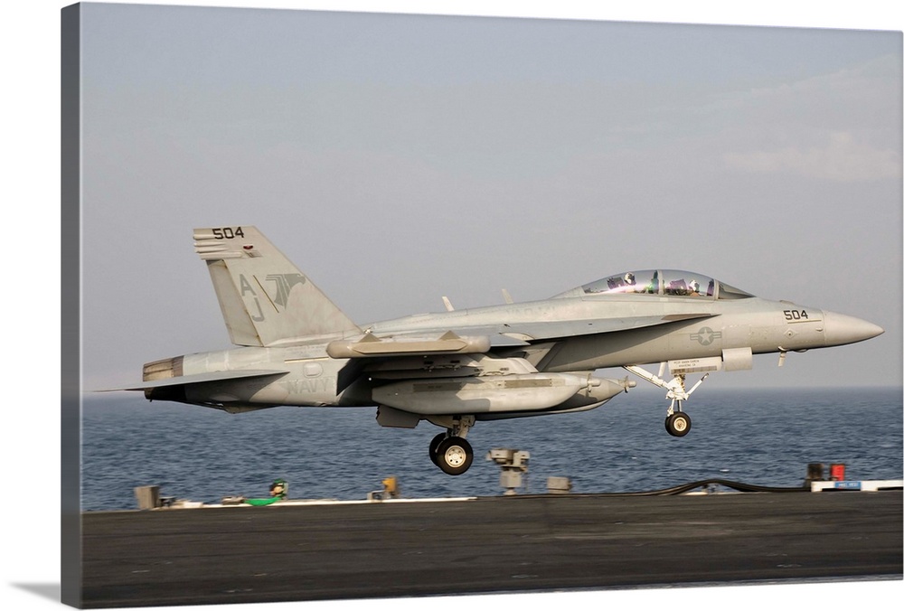Persian Gulf, October 30, 2011 - An EA-18G taking off from the flight deck of USS George H.W. Bush.