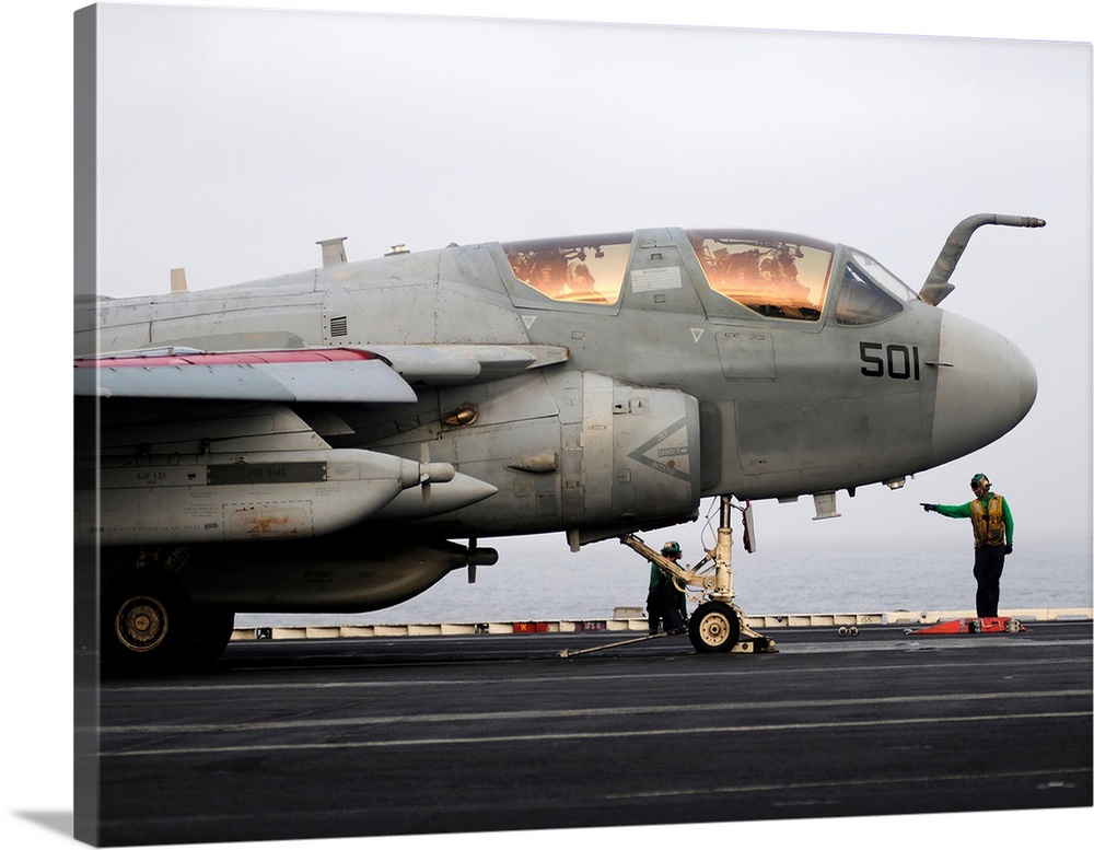 An EA-6B Prowler prepares to launch from the flight deck of USS Abraham Lincoln.
