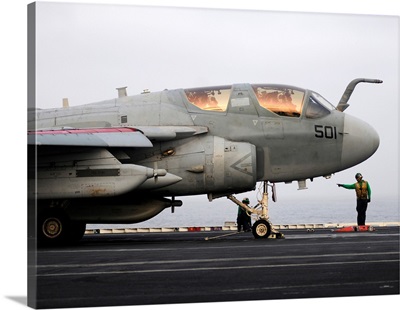 An EA-6B Prowler prepares to launch from the flight deck of USS Abraham Lincoln
