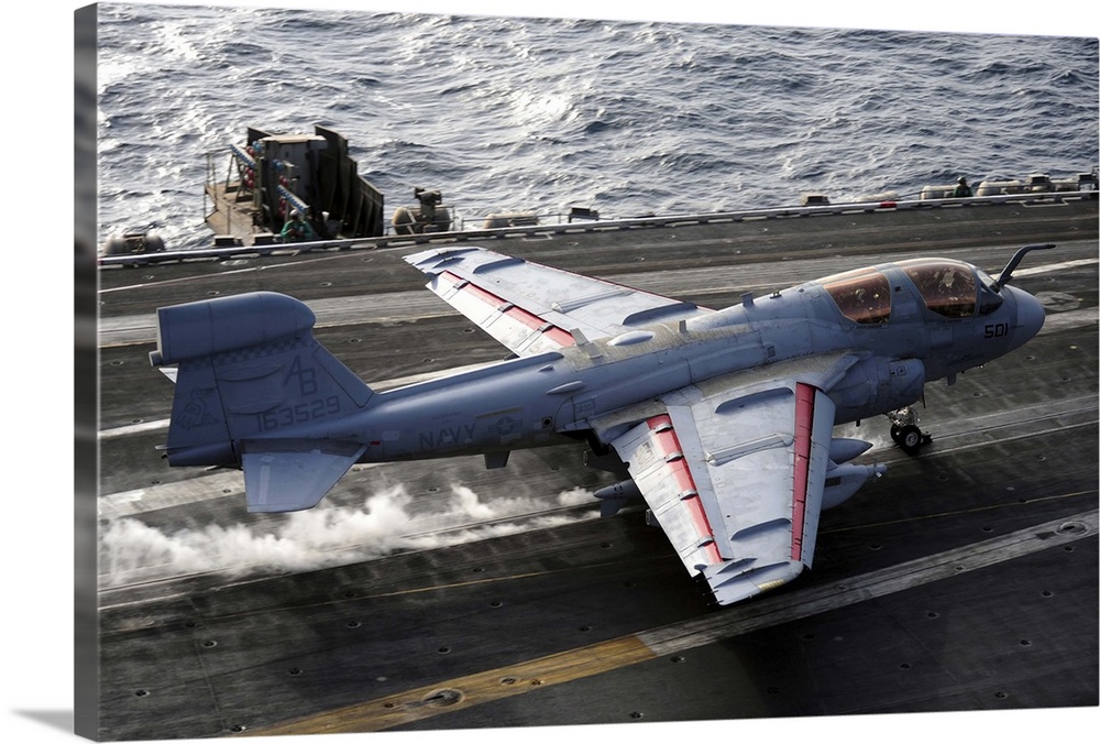 An EA-6B Prowler takes off from the aircraft carrier USS Enterprise.