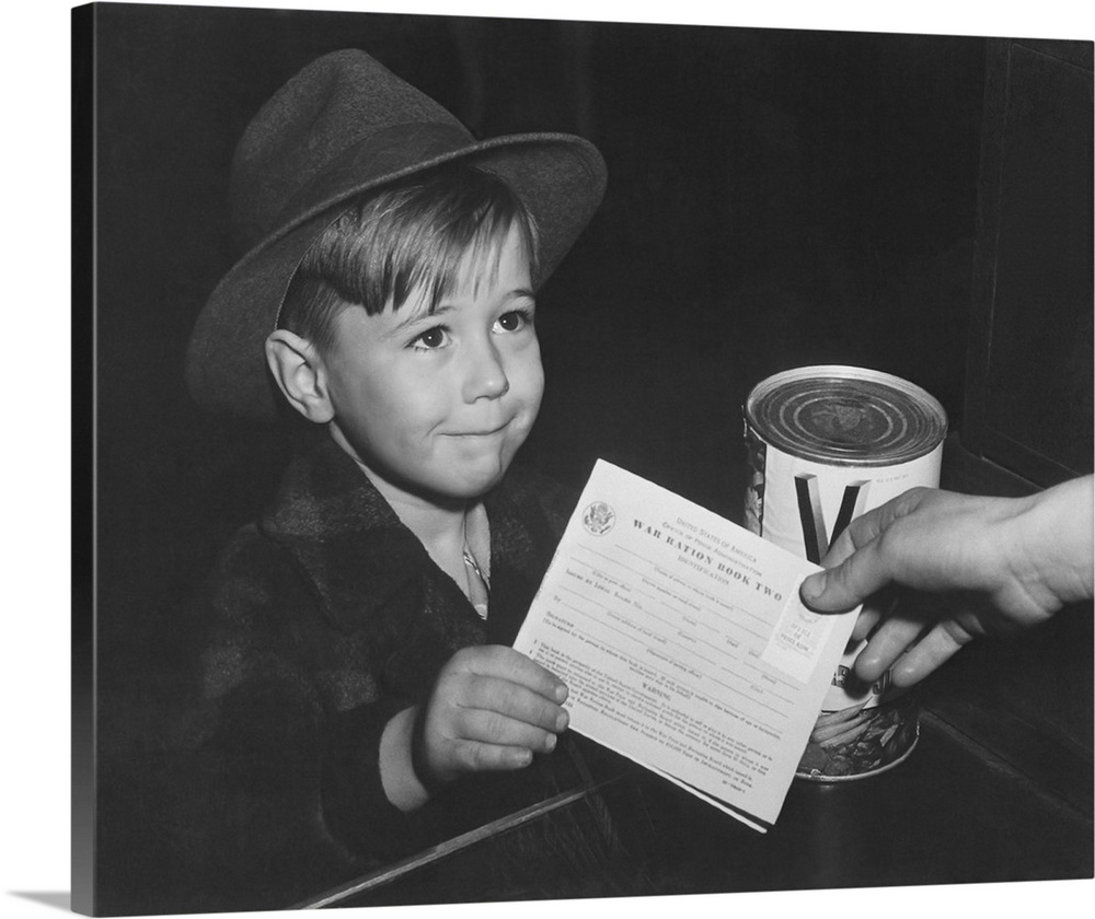 An eager school boy gets his first experience in using War Ration Book Two, circa 1943.