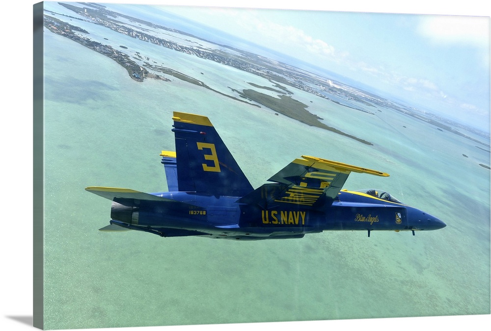 An F/A-18 Hornet of the Blue Angels flies over the Florida Keys.