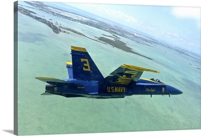 An F/A-18 Hornet of the Blue Angels flies over the Florida Keys