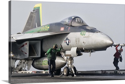 An F/A-18 Super Hornet is ready to launch from a catapult aboard USS Harry S. Truman