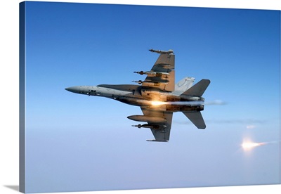 An F/A-18C Hornet aircraft tests its flare countermeasure system