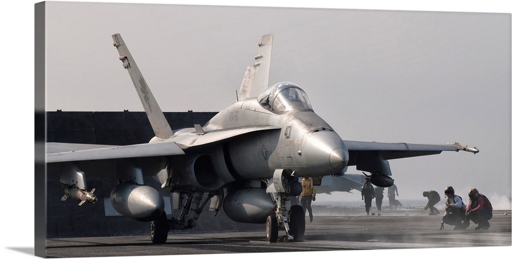 Persian Gulf, October 31, 2011 - An F/A-18C Hornet is ready to launch from the flight deck of USS George H.W. Bush.