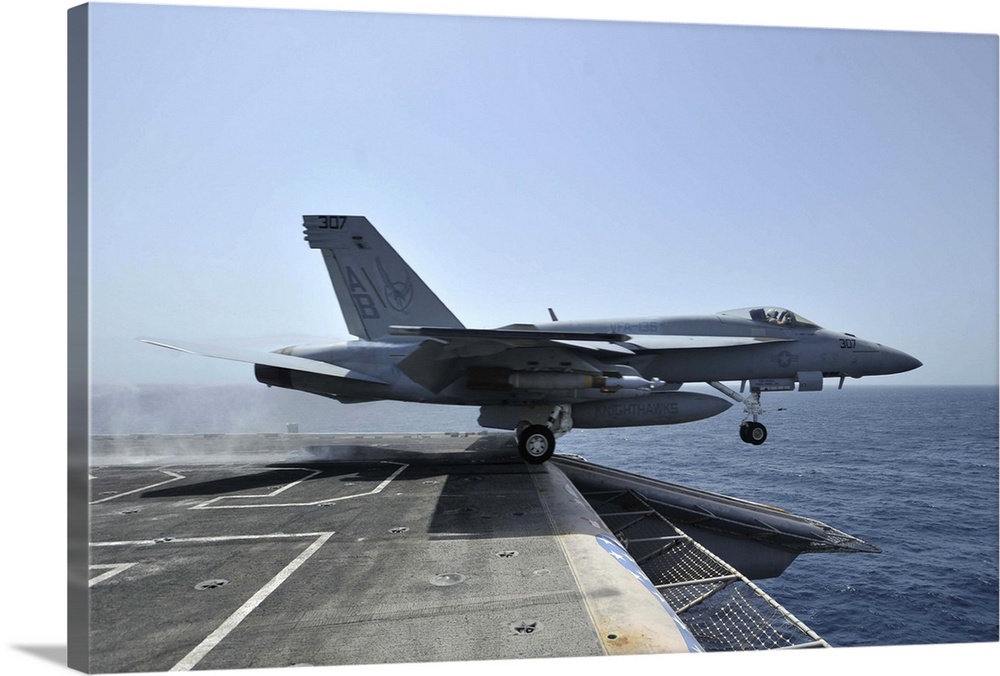 Arabian Sea, March 28, 2011 - An F/A-18E Super Hornet launches from the aircraft carrier USS Enterprise (CVN-65).