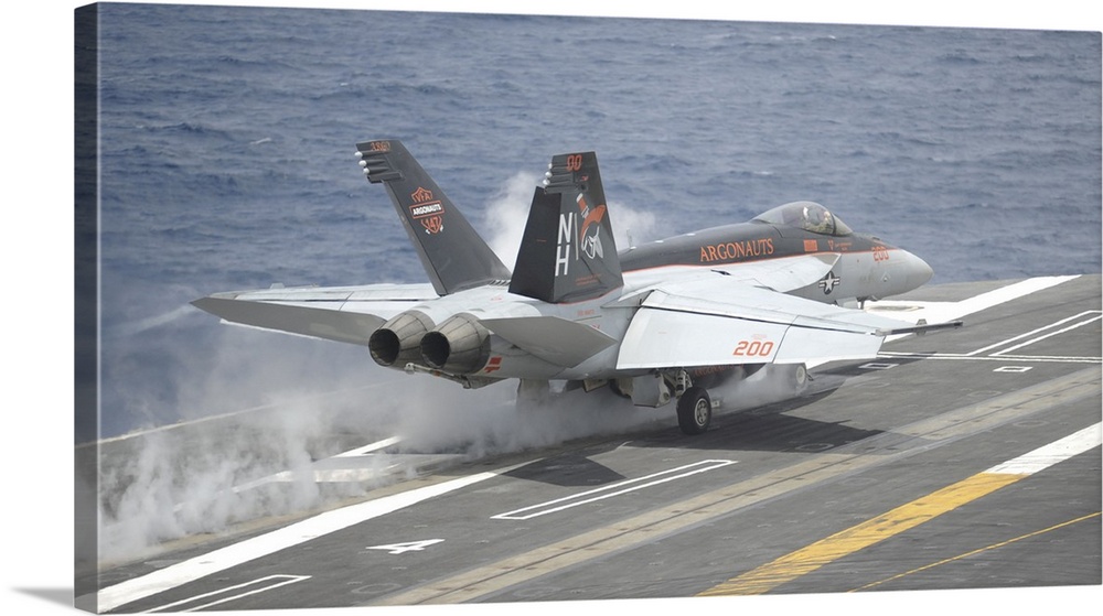 Pacific Ocean, May 5, 2014 - An F/A-18E Super Hornet launches from the aircraft carrier USS Nimitz (CVN 68).
