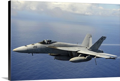 An F/A-18E Super Hornet over the Pacific Ocean