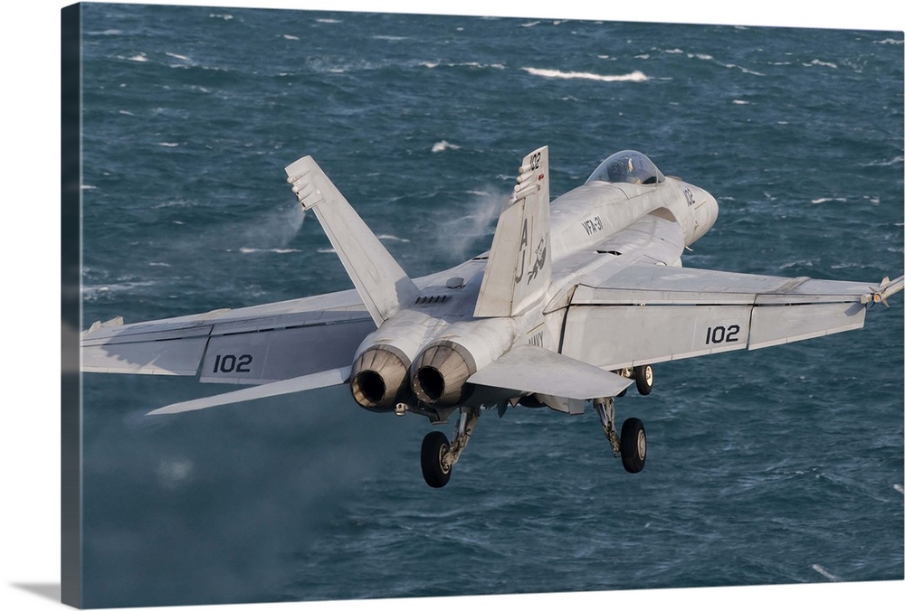 Persian Gulf, October 31, 2011 - An F/A-18E Super Hornet taking off from the flight deck of USS George H.W. Bush.