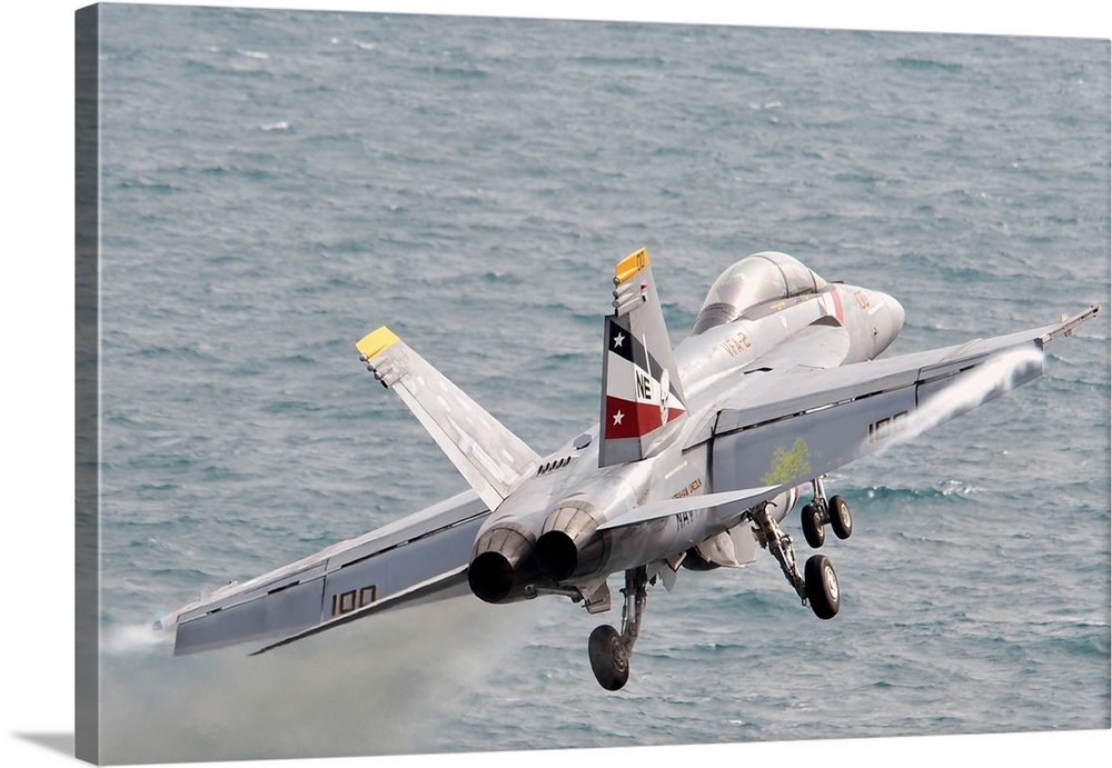 An F/A-18F Super Hornet launches from USS Abraham Lincoln.