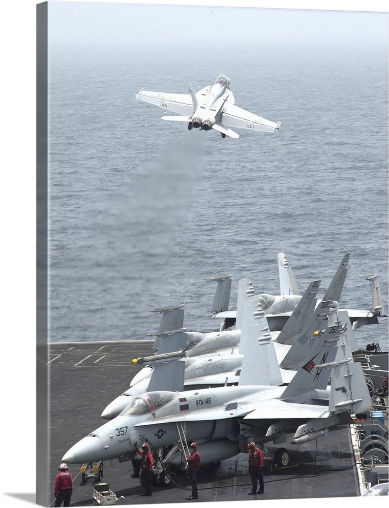 Gulf of Oman, July 13, 2013 - An F/A-18F Super Hornet  launches from the flight deck of the aircraft carrier USS Nimitz.