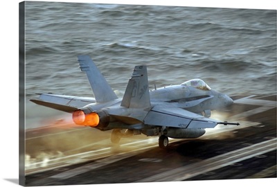 An F/A18C Hornet launches from the flight deck of USS Theodore Roosevelt