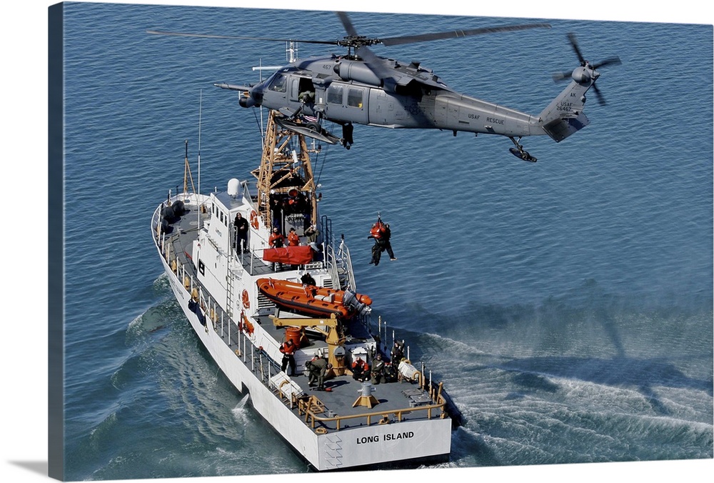 An HH-60G Pave Hawk performs a hoist over U.S. Coast Guard Cutter Long Island.