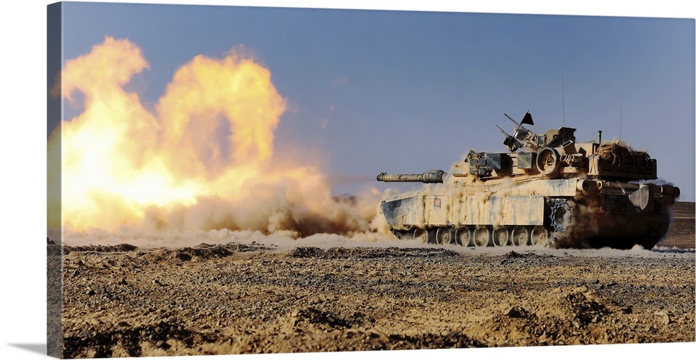 An M1A1 Abrams Main Battle Tank fires its 120 mm smoothbore cannon.