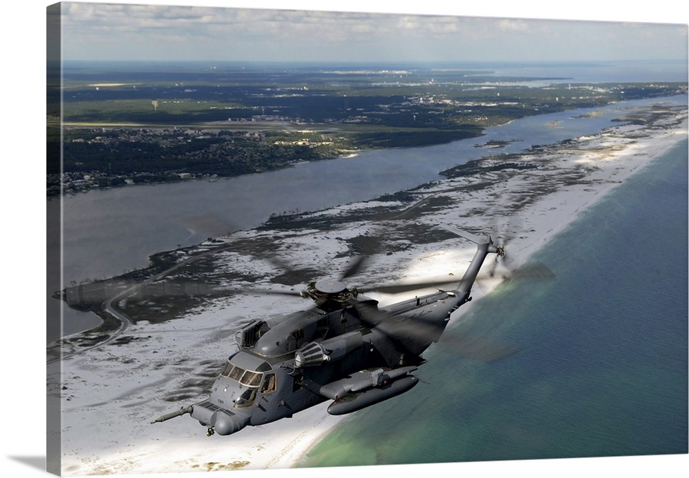 An MH-53 Pave Low flies over the coastline of Florida.