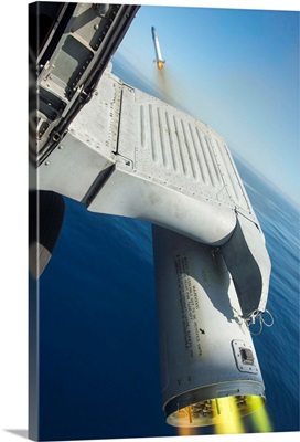 An MH-60R Sea Hawk Helicopter Fires Inert Rockets