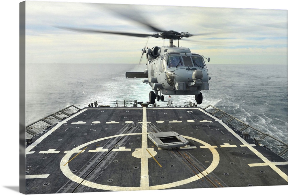 Atlantic Ocean, January 15, 2014 - An MH-60R Sea Hawk helicopter lands aboard the guided-missile frigate USS Halyburton (F...