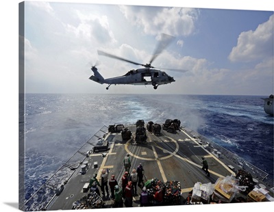 An MH-60R Sea Hawk Transfers Supplies To The Flight Deck Of USS Wayne E Meyer