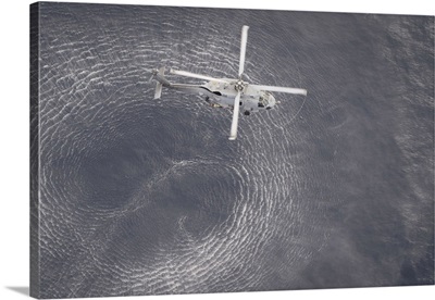 An MH-60R Seahawk Helicopter Hovers Over The Pacific Ocean