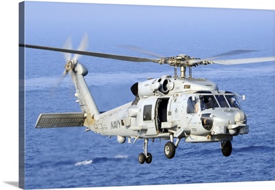 An MH-60R Seahawk Helicopter Takes Off From The Flight Deck Of USS George H.W. Bush