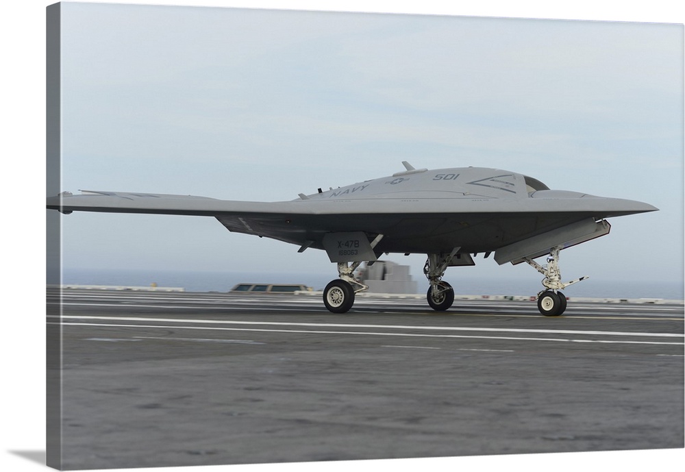 Atlantic Ocean, May 21, 2013 - An X-47B Unmanned Combat Air System (UCAS) demonstrator conducts a touch and go landing on ...