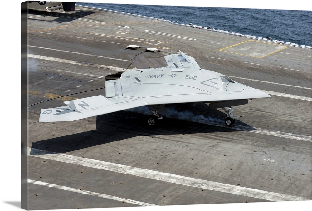 Atlantic Ocean, July 10, 2013 - An X-47B Unmanned Combat Air System (UCAS) makes a carrier-based arrested landing aboard t...