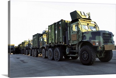 Armored trucks sit on the pier at Morehead City North Carolina awaiting deployment
