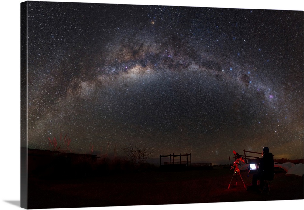 Astronomer with telescope looking at the Milky Way in the Atacama Desert, Chile.