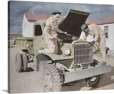 Auxiliaries demonstrate their ability to service trucks at Fort Huachuca, Arizona.