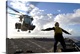 image thumbnail of East China Sea, September 11, 2010 - Aviation Boatswain's Mate directs a CH-53E Super Stallion helicopter aboard the amphi...