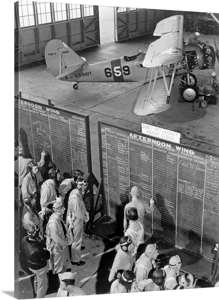 Aviation cadets check flight boards for last minute instructions, 1942.